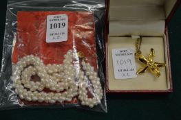 A pearl choker and a decorative gilt metal pendant and chain.