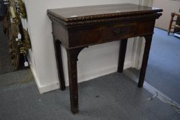 A George III Chippendale period mahogany rectangular fold-over tea table with carved edge, single