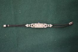 An Art Deco ladies platinum and diamond cocktail watch.