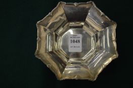 A small silver octagonal shaped pedestal bowl by the Goldsmith & Silversmiths Company Ltd.
