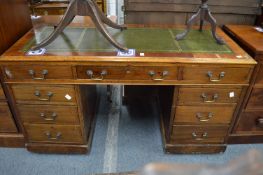 A Victorian walnut pedestal desk.