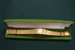 A ladies cocktail watch with gilt metal case and strap by Montine of Switzerland.