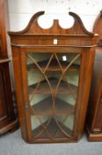 A 19th century mahogany hanging corner display cabinet.