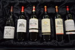 A presentation boxed set of six bottles of French red wine.