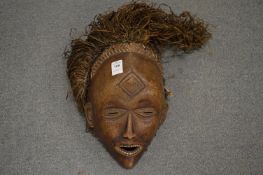 A good carved wood African mask.
