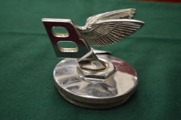 A Bentley Motors winged B, chrome plated radiator hub cap.
