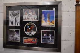 Photographic prints commemorating the Apollo 11 mission, framed as one, one photograph bears