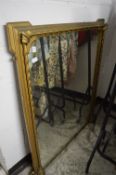 A Victorian gilt framed over-mantel mirror.