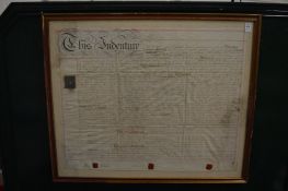 A framed and glazed indenture.