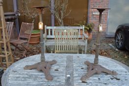 A pair of cast iron stands.