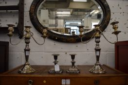 A pair of Sheffield plate twin branch, three light candelabra together with a smaller pair of