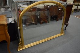 A Victorian style gilt framed over-mantel mirror.