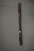 An African carved wood staff.