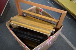 A box of assorted frames, various sizes.