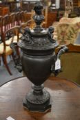 A good pair of classical design bronze twin handled urns and covers.