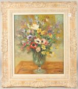 MARCEL DYF (1899-1985). a still life of colourful flowers in a glass vase. Oil on canvas, signed.