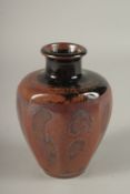 A STUDIO POTTERY TAPERING HEXAGONAL SHAPE VASE, in the manner of Bernard Leach. 15cms high.
