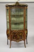 A GOOD LARGE LOUIS XVI DESIGN KINGWOOD BOMBE FRONTED VITRINE with ormolu mounts, three-quarter glass