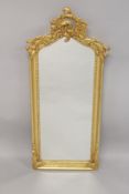 A SMALL LOUIS XVITH STYLE UPRIGHT MIRROR. 44ins high x 18ins wide.