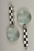 A PAIR OF MAGNIFYING GLASSES with chequered handles.20