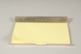 AN ASPREY'S SILVER NOTE PAD HOLDER 