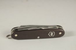 A SWISS VICTORINOX COMBINATION KNIFE.
