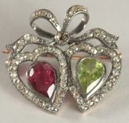 A DIAMOND, PERIDOT AND RUBY HEART BROOCH.