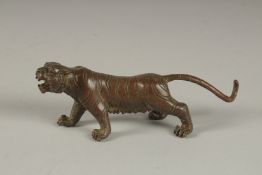 A JAPANESE BRONZE TIGER. 5.5cms long.