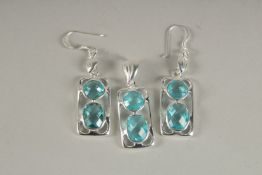 A PAIR OF SILVER AND BLUE TOPAZ EARRINGS AND PENDANT.