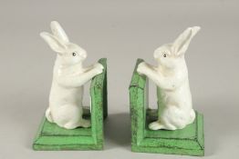 A PAIR OF CAST IRON RABBIT BOOKENDS.