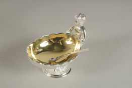 A PLATED CHERUB SALT AND SPOON.