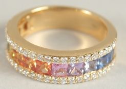 AN 18CT YELLOW GOLD AND MULTI-COLOURED SAPPHIRE AND DIAMOND HALF HOOP RING.
