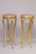 A TALL PAIR OF GILTWOOD CIRCULAR MARBLE TOP STANDS on four curving legs. 44ins high x 18ins