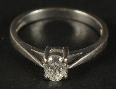 A CERTIFICATED 18K WHITE GOLD OVAL-CUT DIAMOND SOLITAIRE RING, boxed. Diamond 0.33ct, H, SI. Cert