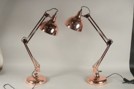 A PAIR OF COPPER ANGLEPOISE LAMPS.
