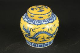 A CHINESE YELLOW GROUND DRAGON GINGER JAR AND COVER, 13.5cms high.