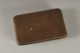 A REPLICA BRASS COCAINE BOX.