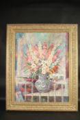 L. SEON. Still life, a bowl of English flowers by a veranda. Signed. Oil on canvas. 24