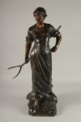 EDOUARD DROUOT (1859-1945) FRENCH A SUPERB LARGE BRONZE OF A YOUNG LADY holding a hay fork. The