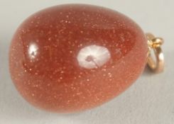 A RUSSIAN 14CT GOLD AND GOLDSTONE EGG PENDANT.