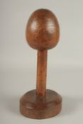 A 19TH CENTURY WOODEN HAT OR WIG STAND. 34cms high.