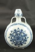 A CHINESE BLUE AND WHITE PORCELAIN MOON FLASK. 31cms high.