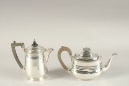 A GEORGIAN STYLE SILVER HOT WATER JUG, London 1912 and a TEAPOT, London 1913. Gross weight 25ozs.