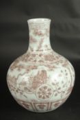 A CHINESE UNDERGLAZE RED PORCELAIN VASE, painted with figures. 29cms high.