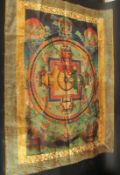 A TIBETAN THANGKA on silk.