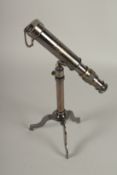 A SMALL TELESCOPE ON A STAND.