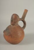 A SOUTH AMERICAN POTTERY VESSEL, modelled as a man. 22cms high.