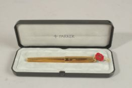 A PARKER PEN.