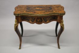 A VERY GOOD VICTORIAN KINGWOOD INLAID FOLDING TOP CARD TABLE, the top inlaid with musical
