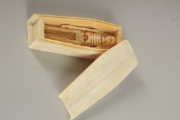 A BONE COFFIN AND SKELETON. 4.5ins high.